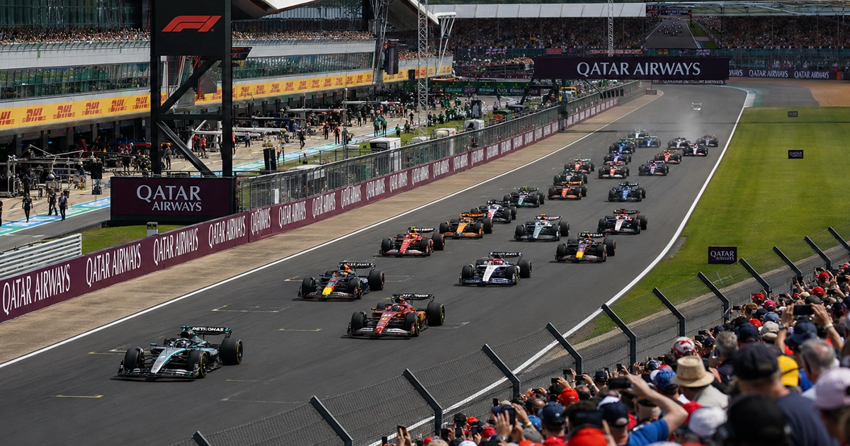 Formula 1 cars racing at the start of the British Grand Prix at Silverstone