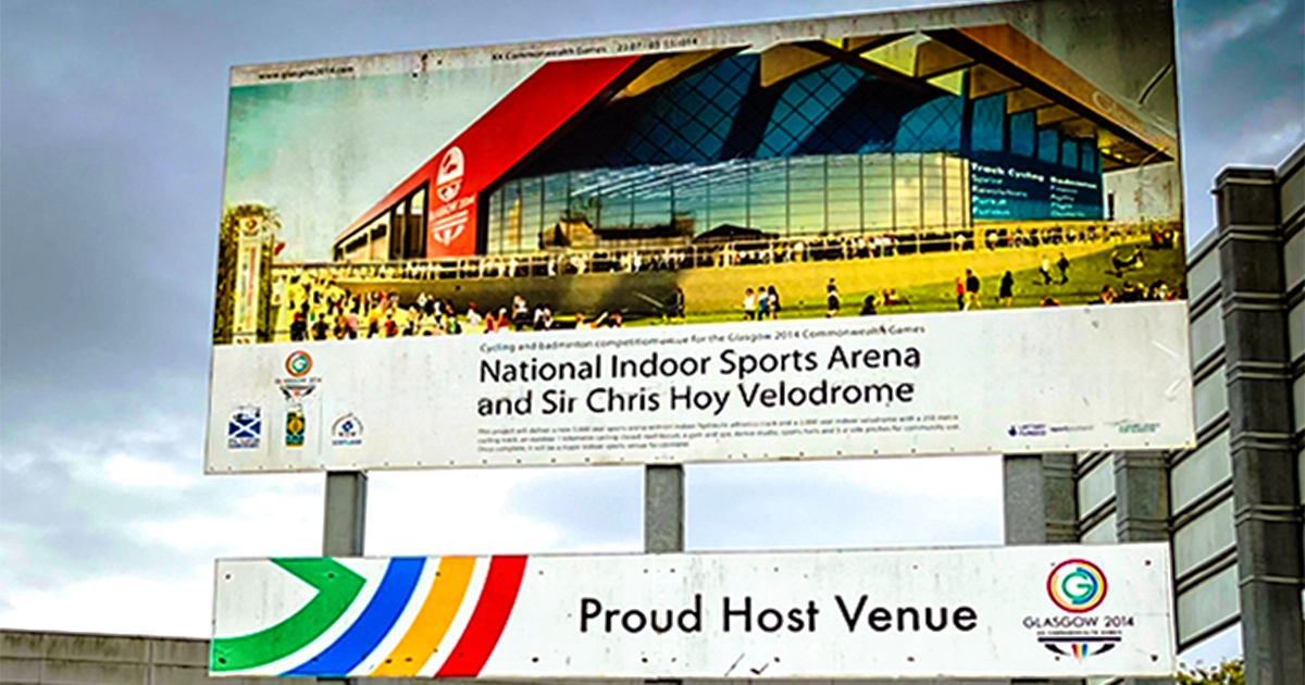 Signage outside the Emirates Arena reading National Indoor Sports Arena and Sir Chris Hoy Velodrome