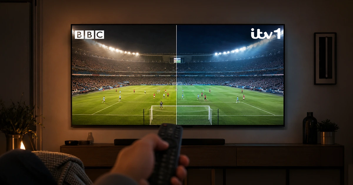 A TV screen split in two showing the same football match with different broadcast colour grading on each half